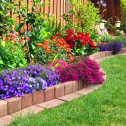 Colorful flowers brick flower bed.jpg