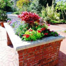 Raised garden brick flower bed.jpg
