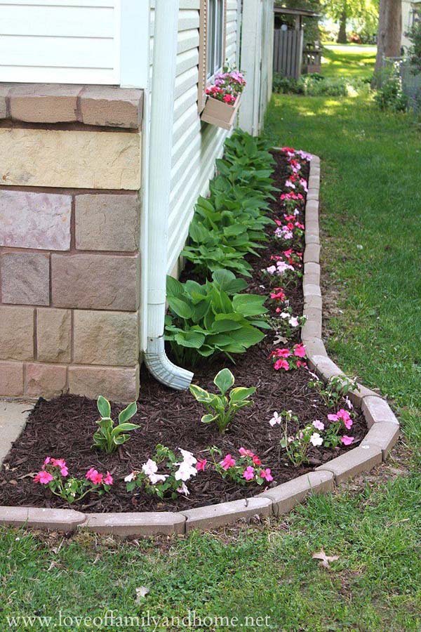 Simple flower bed with brick border.jpg