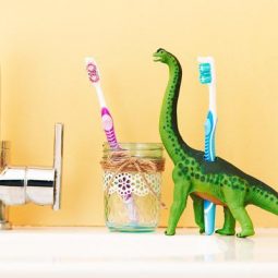 Repurpose unused toys as toothbrush holder.jpg